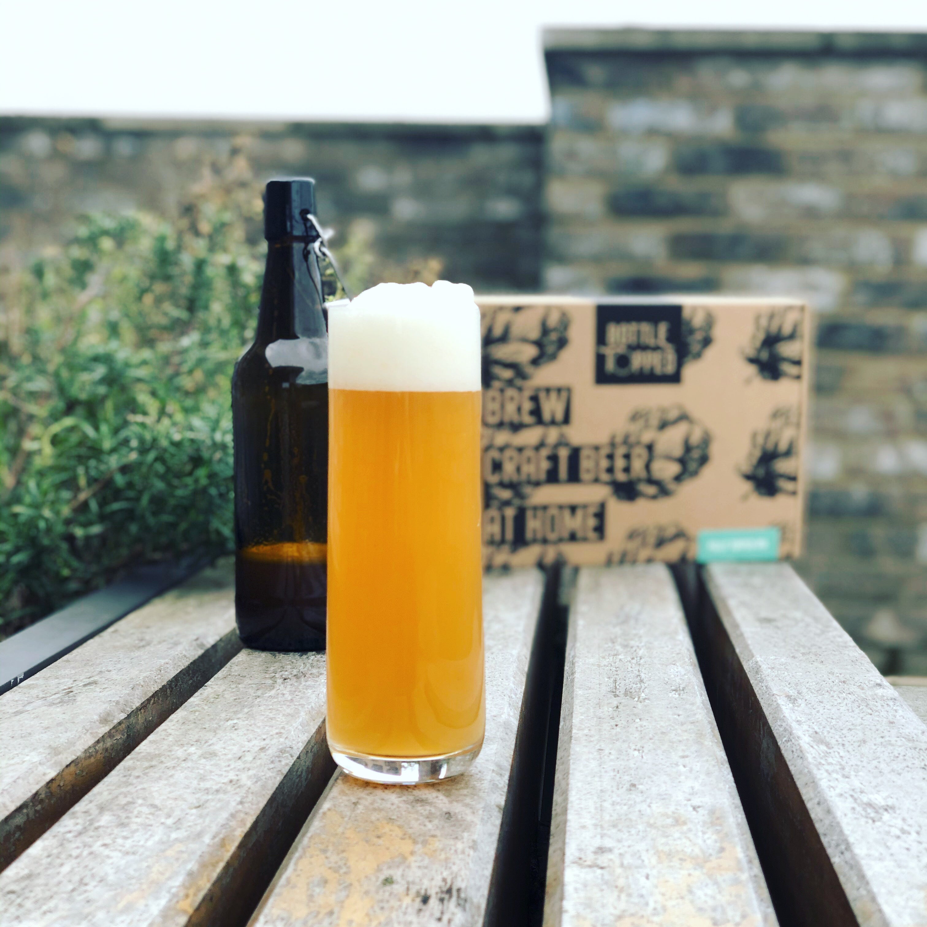 A glass of Bottle Topped craft beer made with our Fully Topped IPA homebrew ingredient kit.